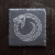 Symbol Jormungandr na kwadratowym kamieniu łupkowym.png